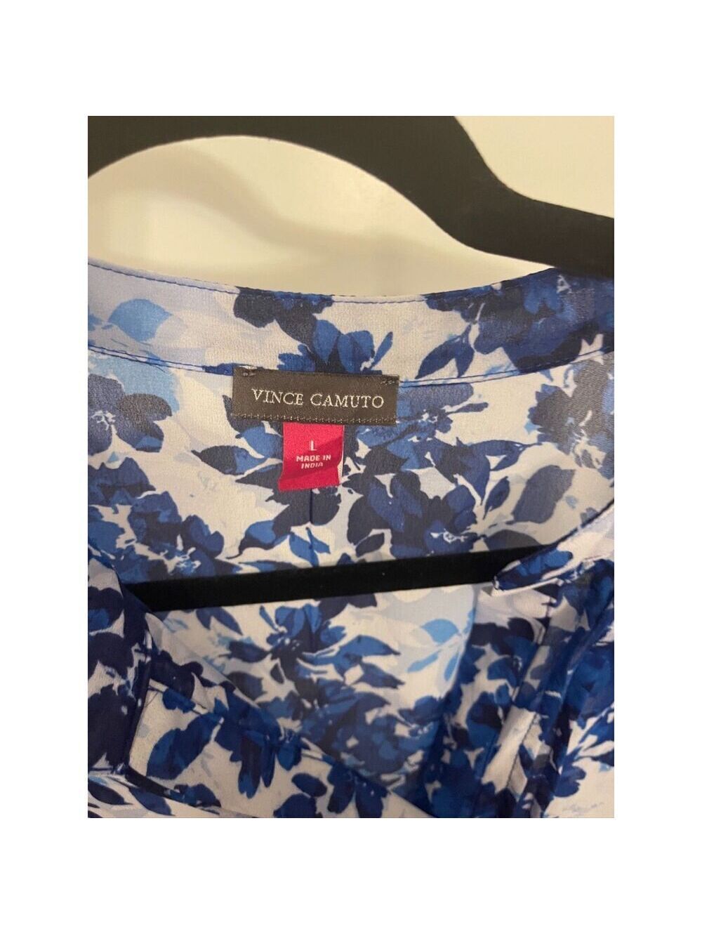 Vince Camuto blue floral blouse featuring ruffle sleeves and a v-neck design